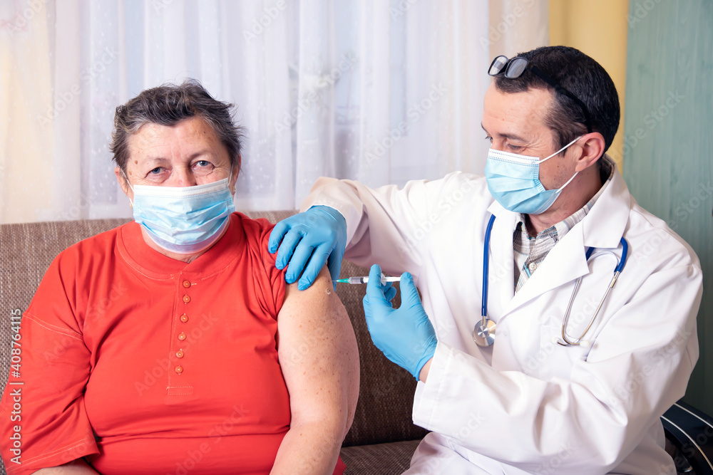 Elderly woman getting coronavirus vaccine