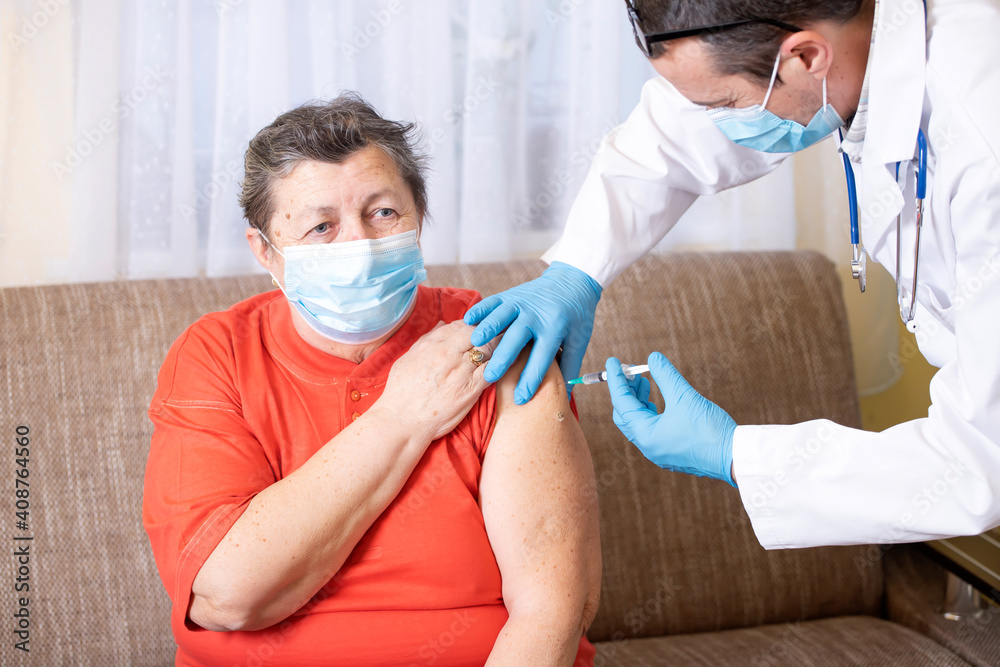 Elderly woman getting coronavirus vaccine