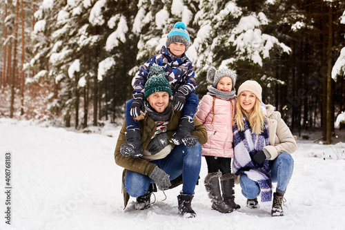 Front view portrait of family a snowy forest