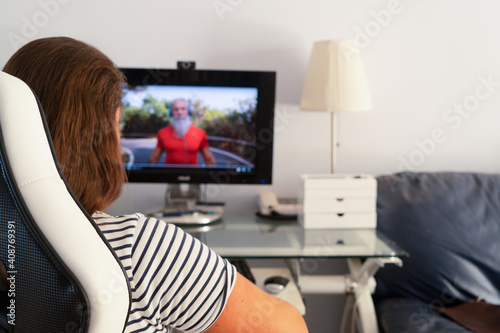 woman comminicating online with senior man