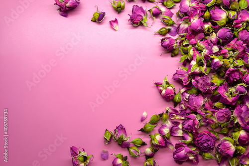 Dried pink roses. Beautiful pink flowers. Herbal plant. Dry pink rosebuds background.