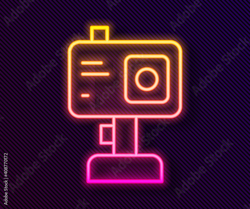 Glowing neon line Action extreme camera icon isolated on black background. Video camera equipment for filming extreme sports. Vector.