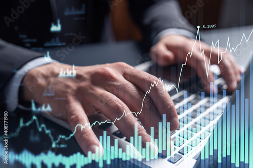 Hands typing the keyboard to research stock market to proceed right investment solutions. Internet trading and wealth management concept. Formal wear. Hologram Forex chart over close up shot.