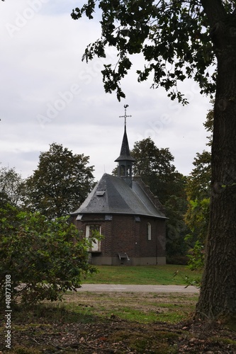 View in rainily  weather to the Sint-Rochuskapel chapel in the hamlet of Kamp between Aijen and Well. Founded in 1715 by Derck Daemen. The chapel was badly damaged in 1945, but rebuilt in 1959 photo