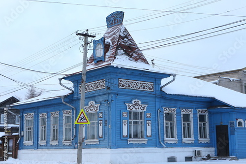 Vintage wooden rural house with ornamental windows, carved frames in Galich town, Kostroma region, Russia. Russian folk style in architecture. Galich landmark, sight photo