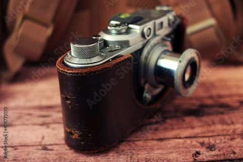 Antique film camera in leather case