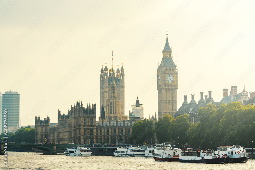 Obraz premium The Palace of Westminster and the Clock Tower with boats on the River Thames in London, England, UK