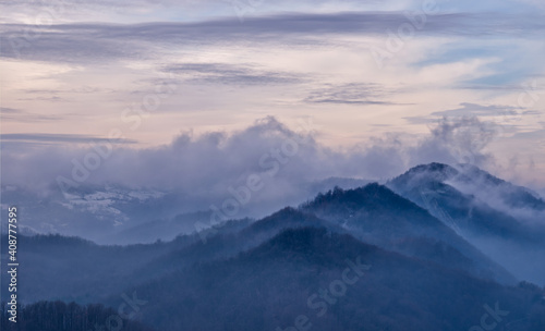 Landscape of mountains in clouds.