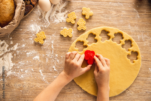 Baking background: cookie making process. Hands are preparing. Top view, closeup