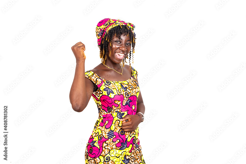 beautiful young woman making winning gesture. beautiful young woman making winning gesture.