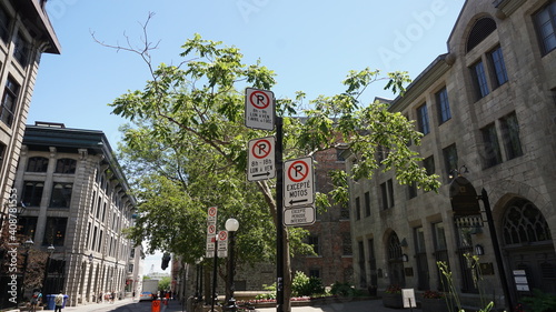 Montreal, QC- Canada - 6-25-2020: Parking challenge. No Parking signs: top: Mon. to Fri 8:00 to 9:00 AM, Apr 1st to Dec 1st, middle: Mon. to Fri 8:00 AM to 6:00 PM, bottom.:except motors © Rania