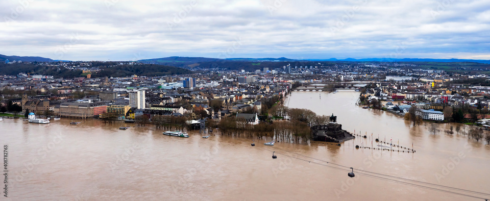 Flooding after heavy rainfall in Koblenz, Deutsches Eck. Koblenz is a German city on the banks of the Rhine and of the Moselle, a multi-nation tributary.