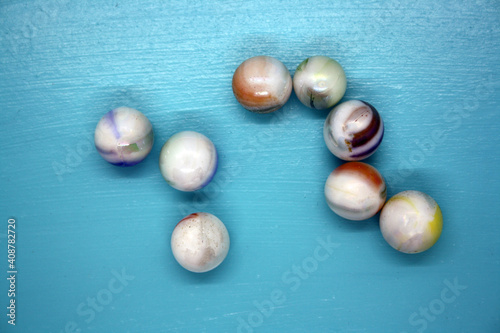 Glass color balls on a blue background.