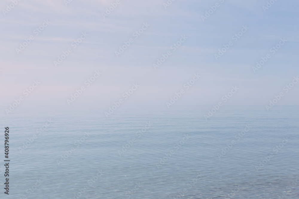 Clear and blue sea with a soft horizon