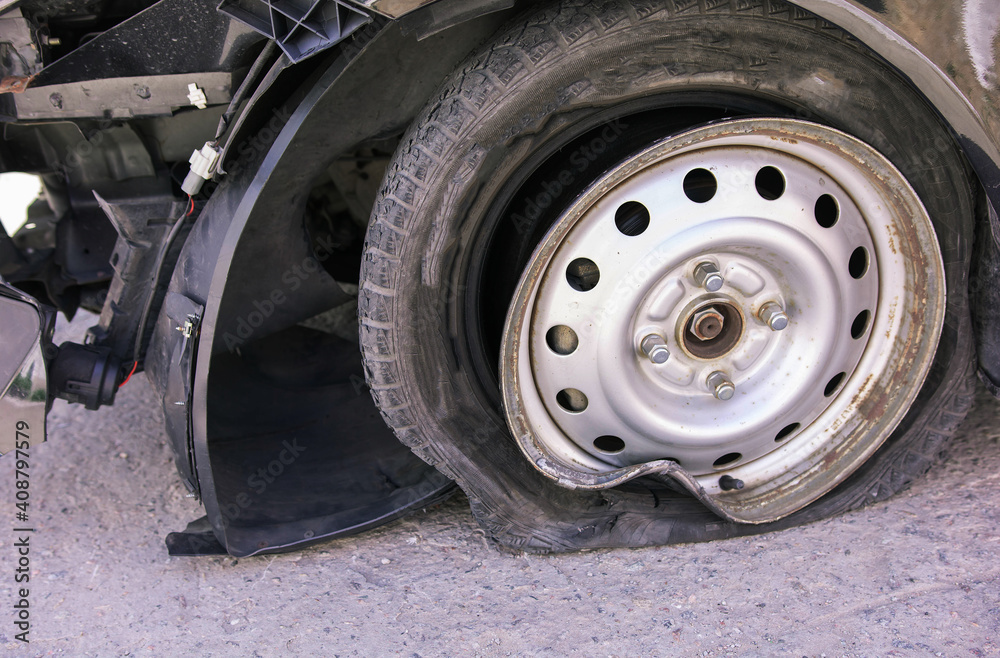 Accident on the road with damage to the car. knocked wheel.