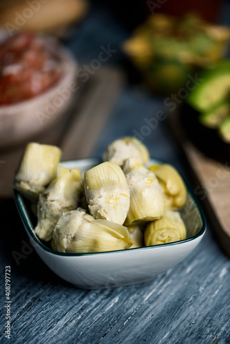 cooked artichoke hearts in a bowl