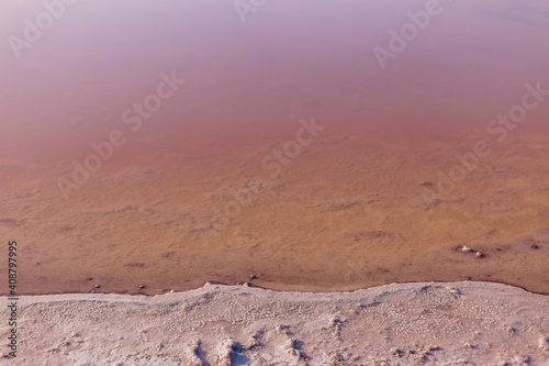 Pink salt at the bottom of a dried lake