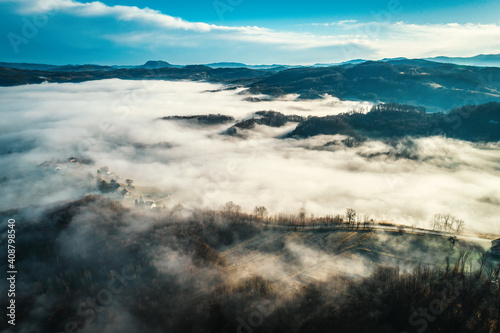 Aerial view of foggy sunrise in Bosnian countryside