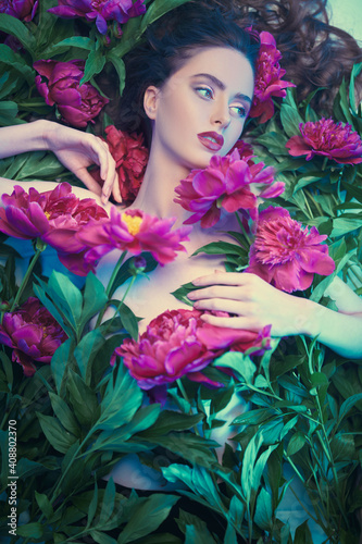 among peony flowers © Andrey Kiselev
