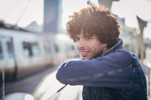 handsome young man on a train station