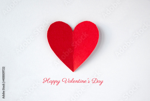 Happy Valentine's Day typography with red heart from paper on white background. photo