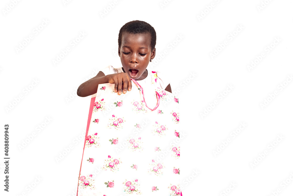 little child girl surprised by opening a shopping bag. little child girl surprised by opening a shopping bag.