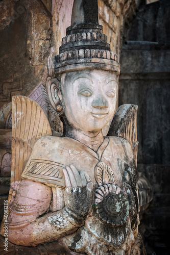 Photography Detail of a nat statue (angel of spirit) in Tharkhaung buddhist monastery in Bur