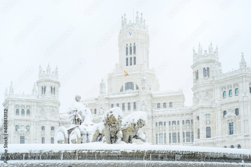 fountain at the Plaza de Cibeles in Madrid covered in snow after the storm Filomena passed through the capital. Nevada in Madrid. Filomena storm, extreme cold in the capital of Spain