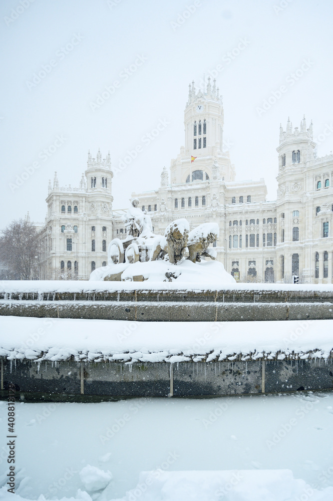 fountain at the Plaza de Cibeles in Madrid covered in snow after the storm Filomena passed through the capital. Nevada in Madrid. Filomena storm, extreme cold in the capital of Spain