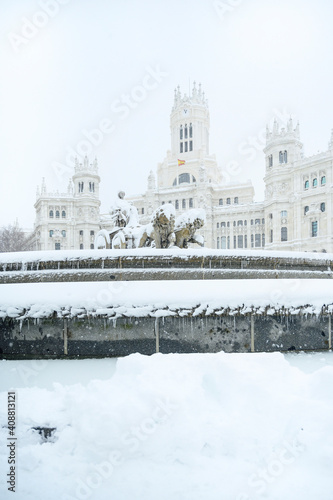 fountain at the Plaza de Cibeles in Madrid covered in snow after the storm Filomena passed through the capital. Nevada in Madrid. Filomena storm, extreme cold in the capital of Spain