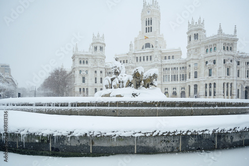 fountain at the Plaza de Cibeles in Madrid covered in snow after the storm Filomena passed through the capital. Nevada in Madrid. Filomena storm, extreme cold in the capital of Spain photo