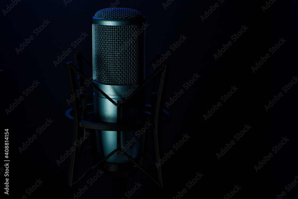 Blue professional microphone isolated on black Blue professional microphone isolated on black