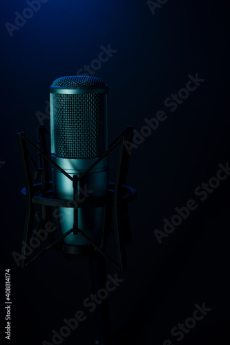 Professional blue studio microphone on black