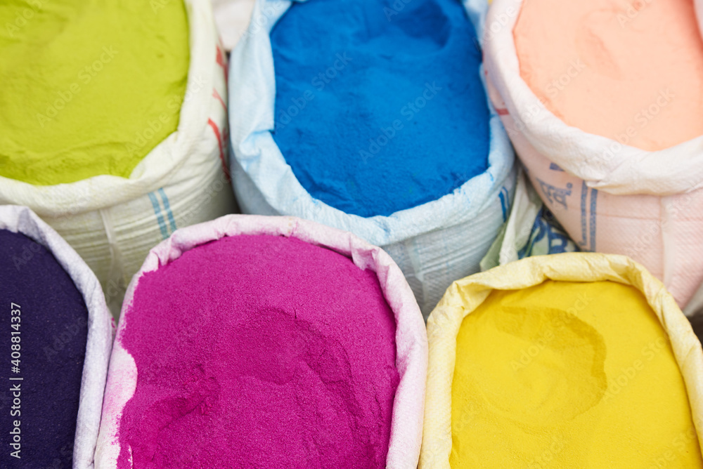 bags of colored powder, holi dye in the street bazaar