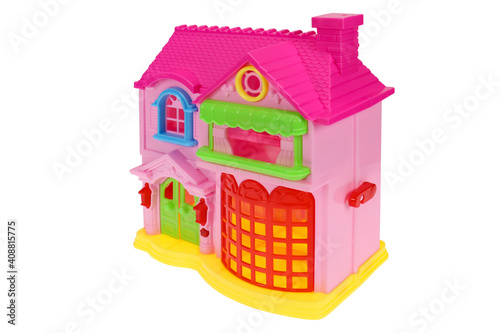 A toy house. Pink dollhouse on white background, isolated