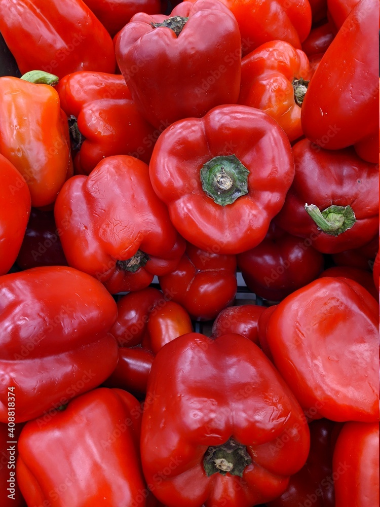 lot of red bell pepper in the market closeup photo lot of red bell pepper in the market closeup photo