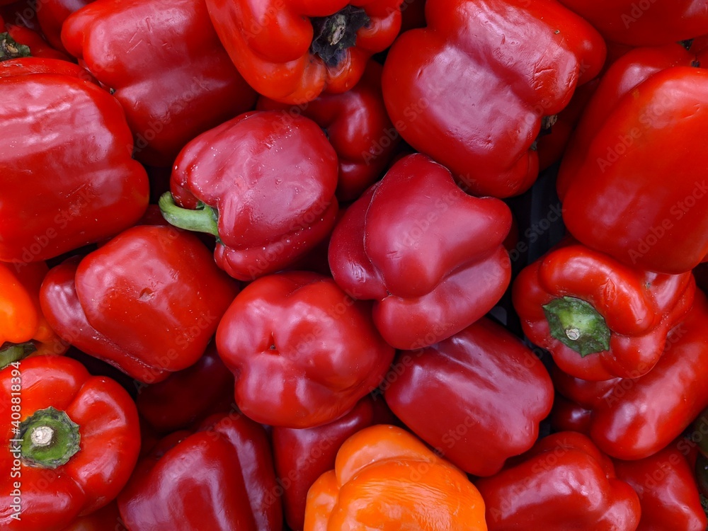 lot of red bell pepper in the market closeup photo lot of red bell pepper in the market closeup photo