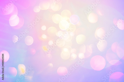 Bright pearly fantasy background. Lens flare bokeh in neon colors on a sunny sky. Funny summer or spring texture