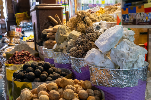 Herbs, spices, dried lemons, menthol crystals, blue dye at the old market in Dubai, United Arab Emirates