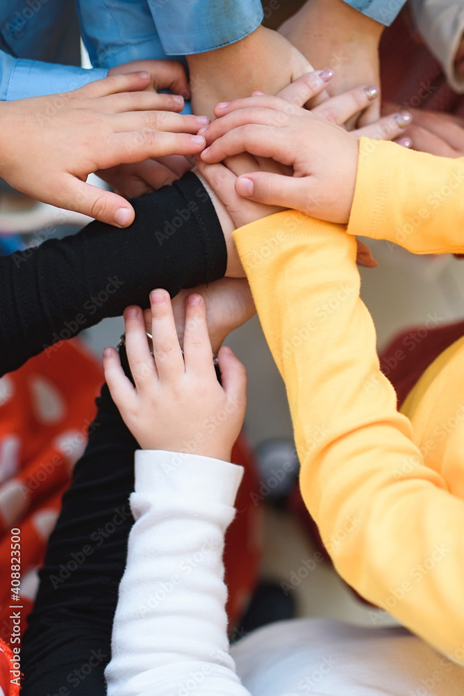 children holding hands together children holding hands together