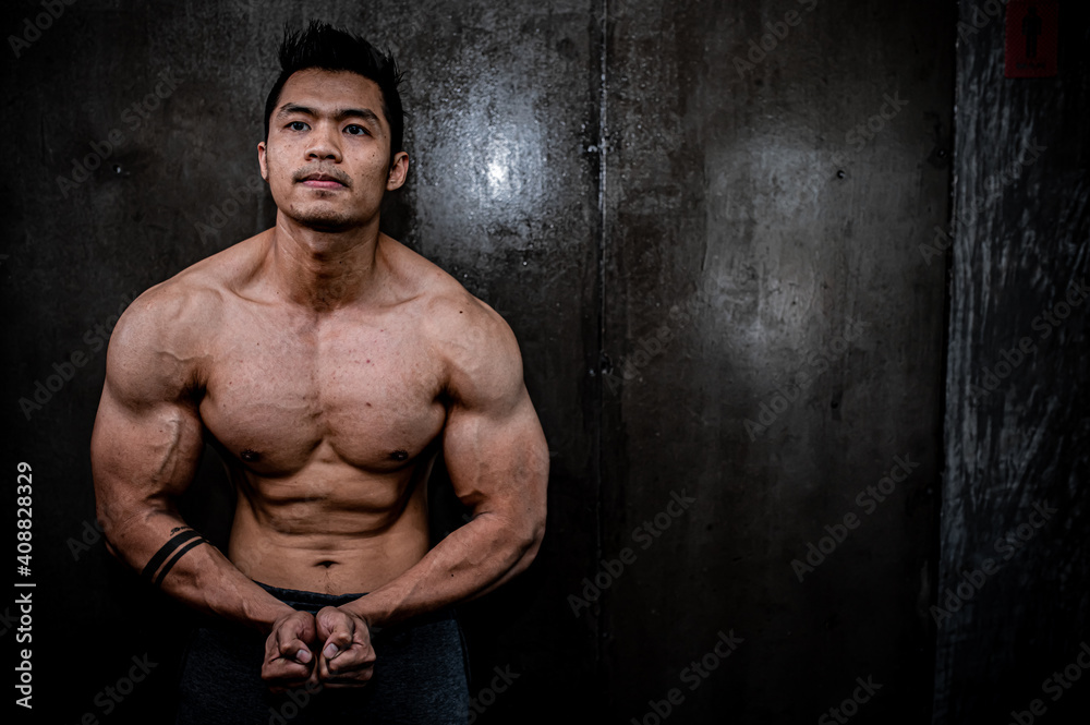 Fototapeta premium Portrait of asian man big muscle at the gym,Thailand people,Workout for good healthy,Body weight training,Fitness at the gym concept