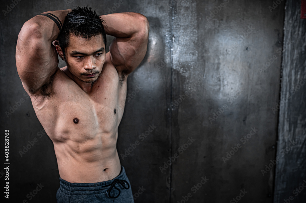 Fototapeta premium Portrait of asian man big muscle at the gym,Thailand people,Workout for good healthy,Body weight training,Fitness at the gym concept