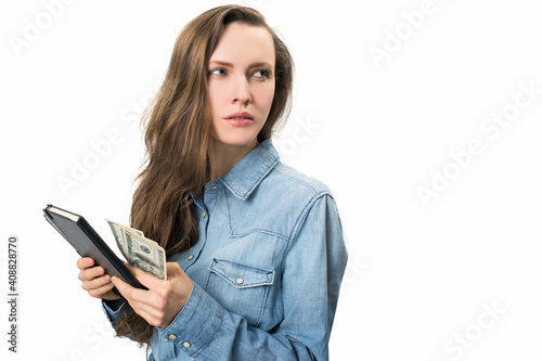 Young woman holding dollars in her hand photo