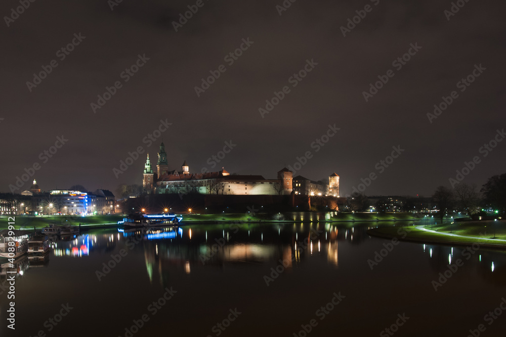 The evening panorama of Krakow promenade and Vistula river with Wawel Castle on the hill