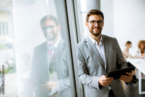 Young modern businessman us...