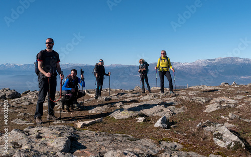 BEAUTIFUL PHOTO OF A GROUP OF HIKERS ON THE TOP OF THE MOUNTAIN
