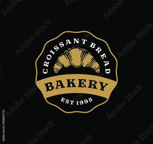 Logo badge of croissant bread in vintage design. bakery label design on black background