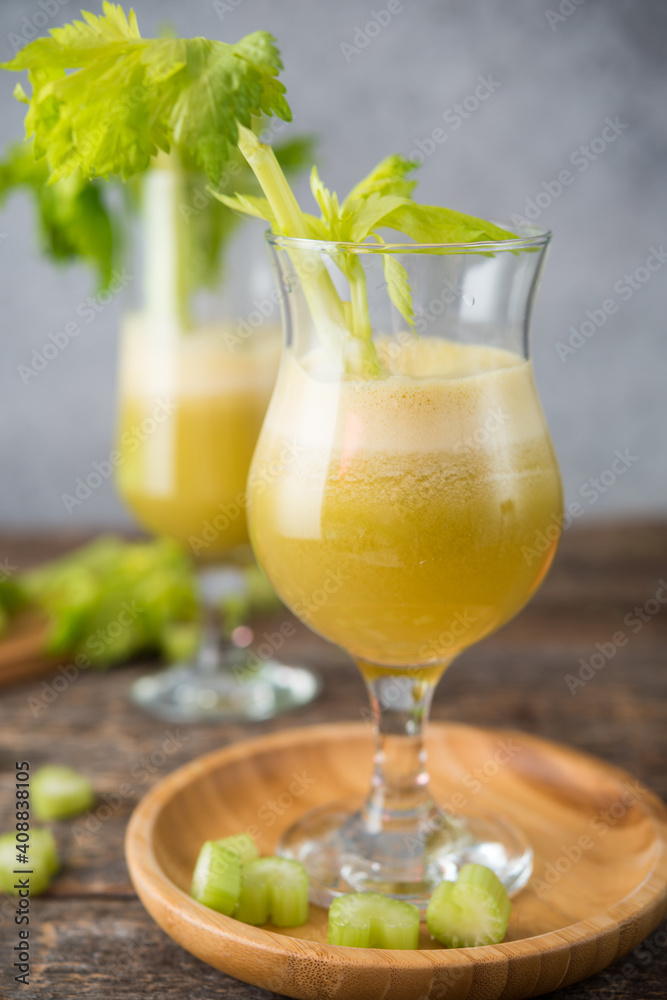 Fresh juice apple and celery in a clear glass, vegetarian food, clean food Fresh juice apple and celery in a clear glass, vegetarian food, clean food