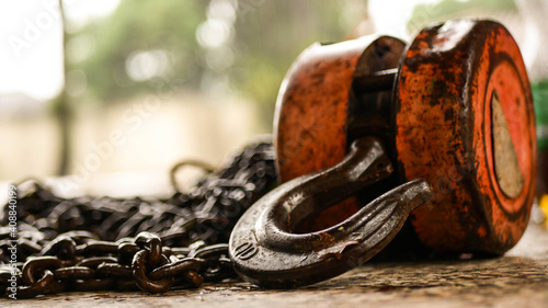 hook and chains lying on floor photo