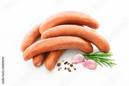 Raw meat sausages isolated on white background photo